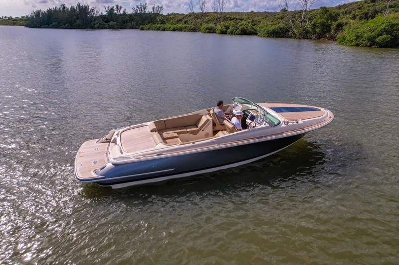  Yacht Photos Pics 2017 Chris-Craft Corsair 28 Heritage Edition boat cruising on calm water.