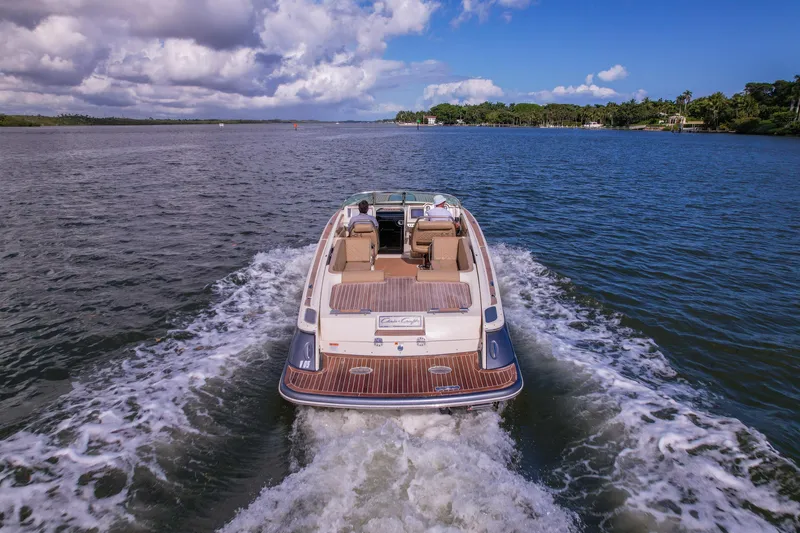  Yacht Photos Pics 2017 Chris-Craft Corsair 28 Heritage Edition cruising on a scenic waterway.