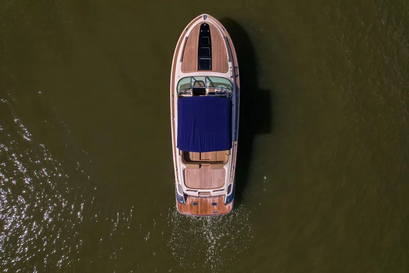  Yacht Photos Pics Aerial view of 2017 Chris-Craft Corsair 28 Heritage Edition boat on water.