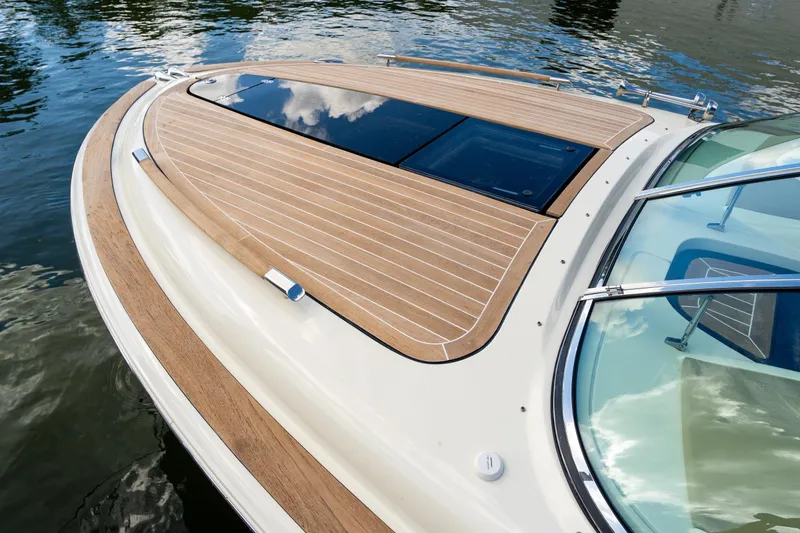  Yacht Photos Pics 2017 Chris-Craft Corsair 28 Heritage Edition boat with elegant teak deck on water.