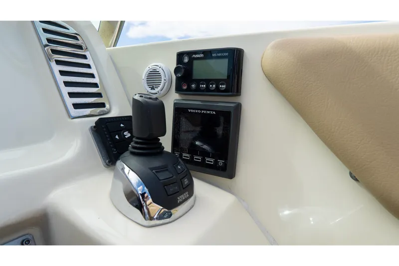  Yacht Photos Pics Control panel of 2017 Chris-Craft Corsair 28 Heritage Edition with joystick and audio system.