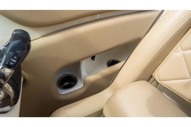  Yacht Photos Pics 2017 Chris-Craft Corsair 28 Heritage Edition interior with beige leather and cup holders.