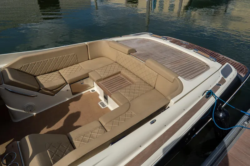  Yacht Photos Pics Luxurious seating on 2017 Chris-Craft Corsair 28 Heritage Edition boat, docked by the water.