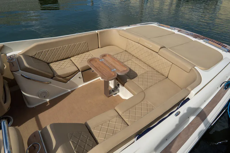  Yacht Photos Pics Luxurious interior of 2017 Chris-Craft Corsair 28 Heritage Edition boat with tan leather seating.