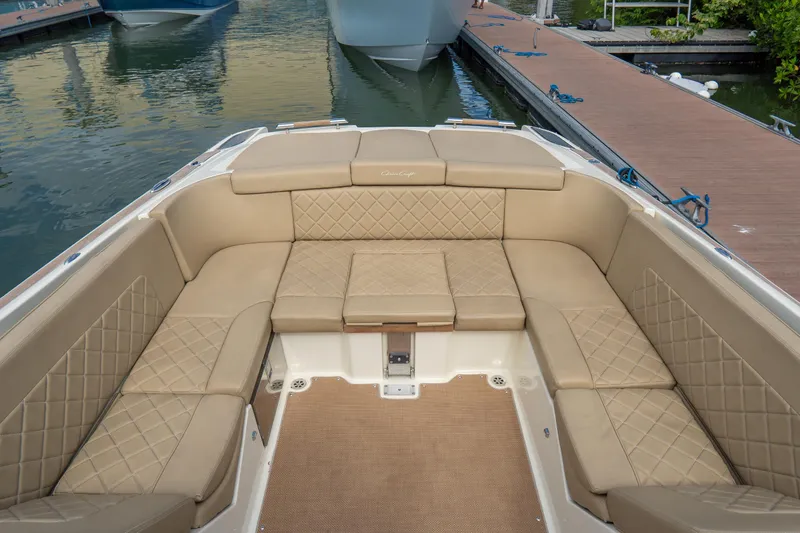  Yacht Photos Pics Luxurious interior of 2017 Chris-Craft Corsair 28 Heritage Edition boat with tan leather seating.