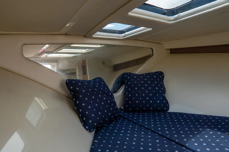  Yacht Photos Pics Interior cabin of 2017 Chris-Craft Corsair 28 Heritage Edition with skylight and blue cushions.