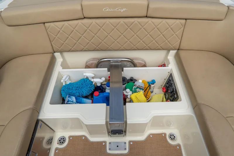  Yacht Photos Pics 2017 Chris-Craft Corsair 28 Heritage Edition boat storage compartment with cleaning supplies.