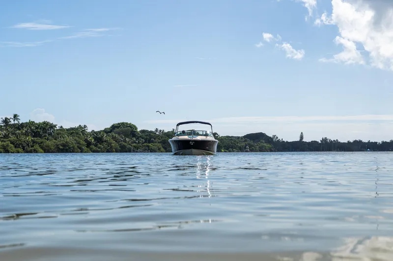  Yacht Photos Pics 2017 Chris-Craft Corsair 28 Heritage Edition on calm water, scenic background.