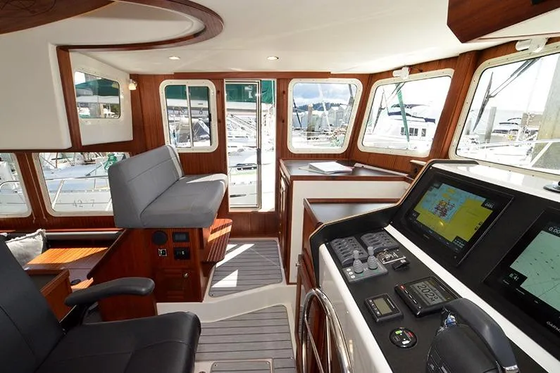 San Juan Explorer Yacht Photos Pics Interior of 2020 American Tug 362, featuring modern navigation equipment and comfortable seating.