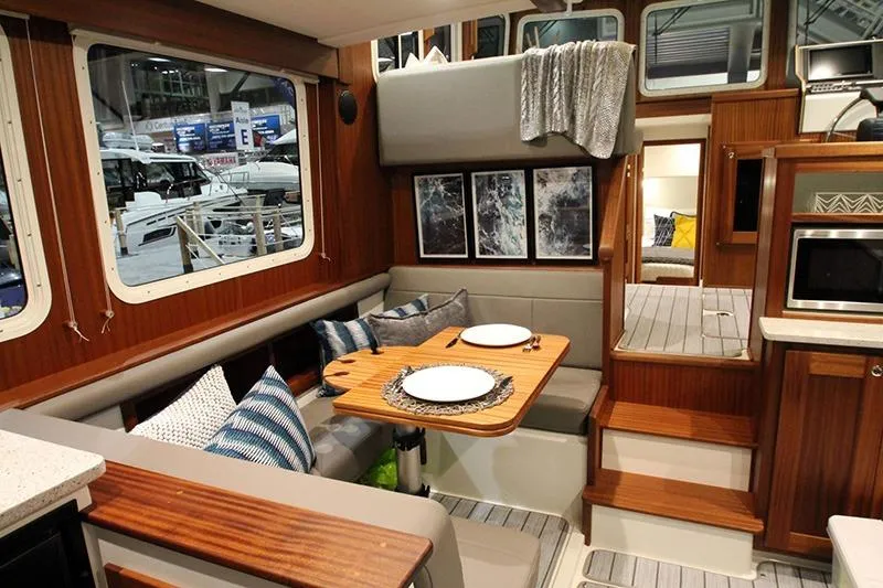 San Juan Explorer Yacht Photos Pics Interior of 2020 American Tug 362 with cozy dining area and modern decor.