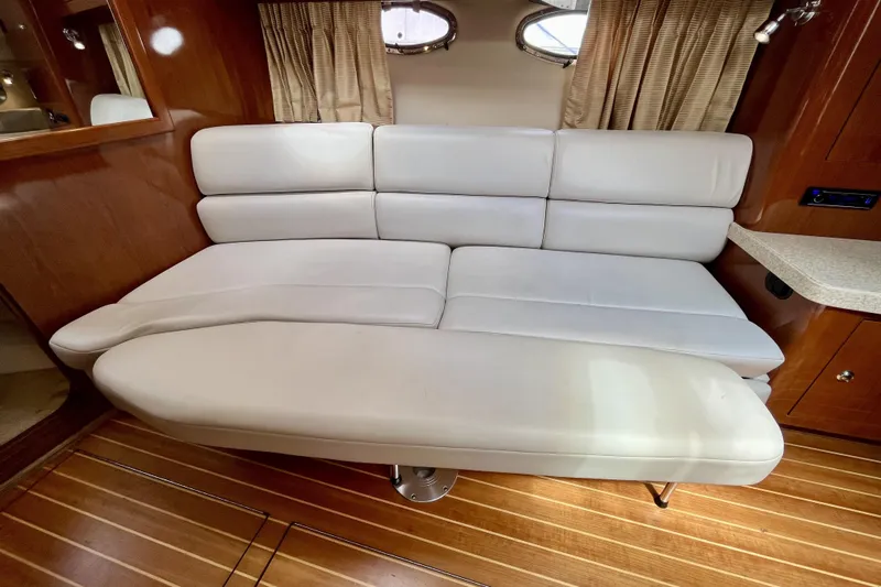  Yacht Photos Pics Luxurious interior of 2005 Regal Commodore 3560 yacht with white leather seating.