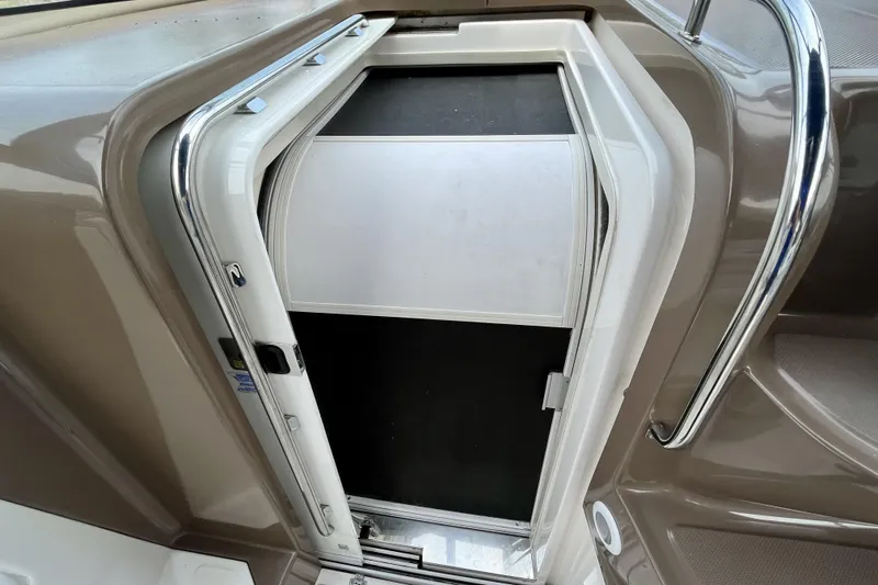 Yacht Photos Pics 2005 Regal Commodore 3560 boat cabin door with chrome handle and sleek design.