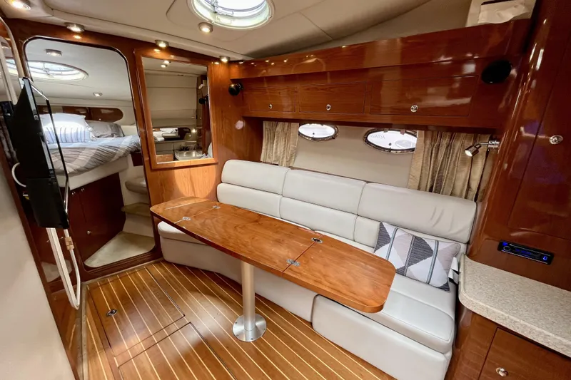  Yacht Photos Pics Luxurious interior of 2005 Regal Commodore 3560 yacht with wood accents and cozy seating.