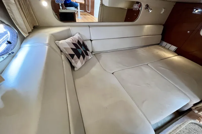  Yacht Photos Pics 2005 Regal Commodore 3560 interior with beige leather seating and geometric pillow.