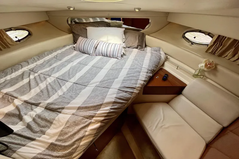  Yacht Photos Pics Luxurious cabin interior of 2005 Regal Commodore 3560 yacht with cozy bed and seating.