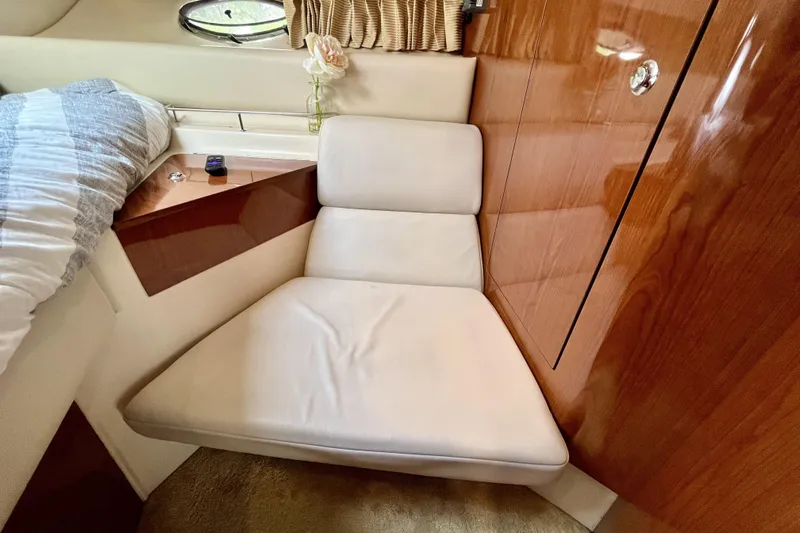  Yacht Photos Pics Luxurious interior of 2005 Regal Commodore 3560 yacht with plush seating and wood paneling.