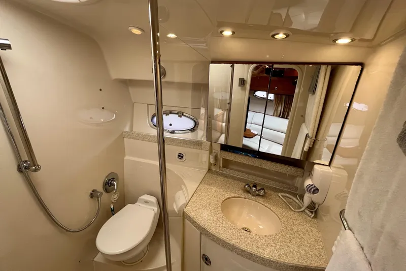  Yacht Photos Pics Luxurious bathroom in 2005 Regal Commodore 3560 yacht with modern amenities and elegant design.