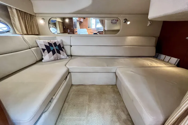  Yacht Photos Pics Luxurious interior of 2005 Regal Commodore 3560 yacht with plush seating and decorative pillow.