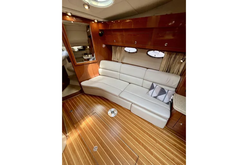  Yacht Photos Pics Luxurious interior of 2005 Regal Commodore 3560 yacht with leather seating and wooden flooring.