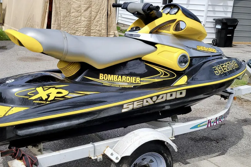  Yacht Photos Pics Yellow and black Sea-Doo jet ski on a trailer, featuring Bombardier branding.