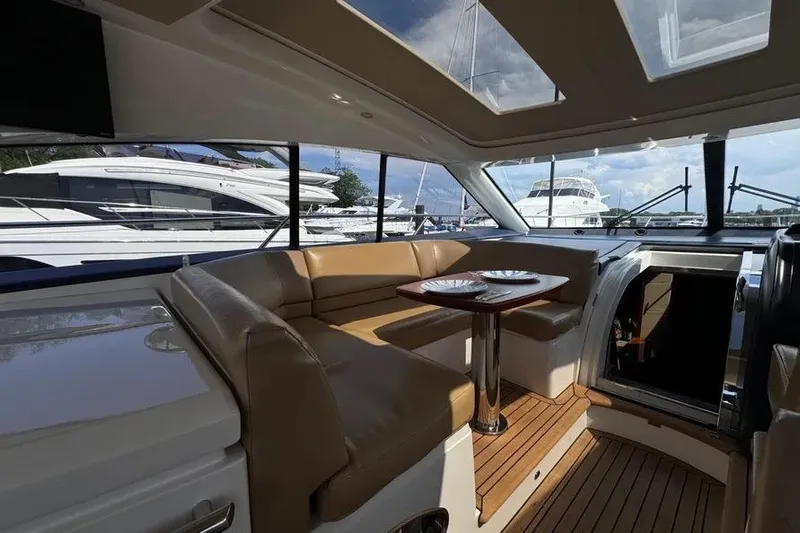 Yacht Photos Pics Luxurious interior of 2008 Princess V53 yacht with leather seating and wooden flooring.
