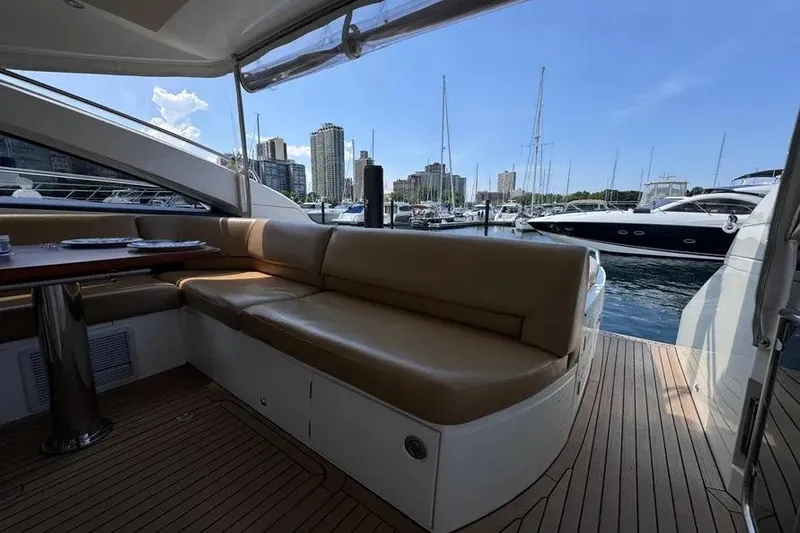  Yacht Photos Pics Luxurious 2008 Princess V53 yacht interior with marina view and city skyline.