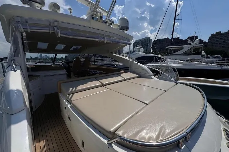  Yacht Photos Pics 2008 Princess V53 yacht with spacious deck and luxurious seating, docked at marina.