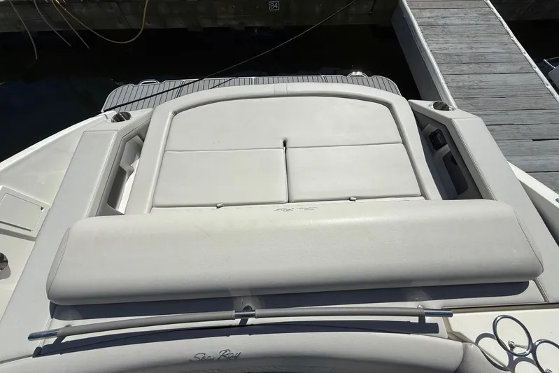  Yacht Photos Pics 2021 Sea Ray SLX 310 boat with spacious sunpad and sleek design at dock.