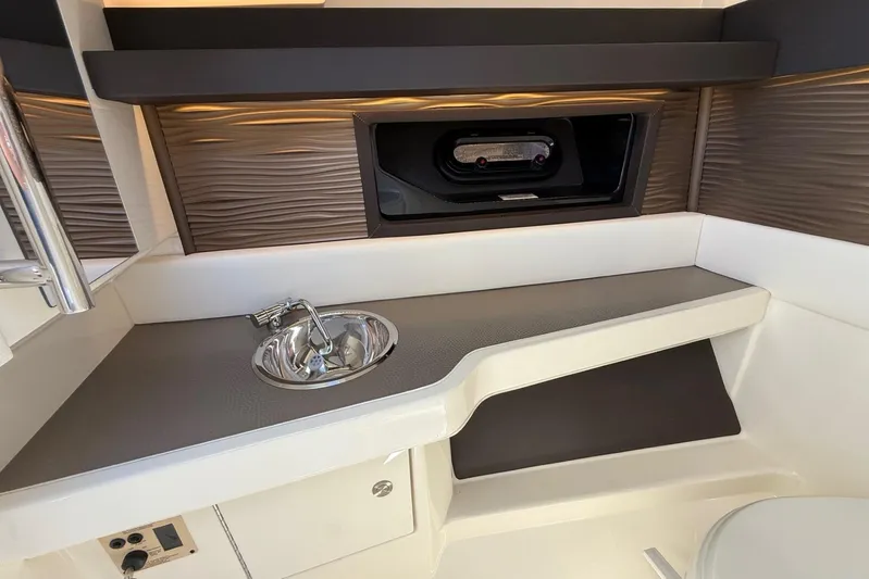  Yacht Photos Pics 2021 Sea Ray SLX 310 interior with sleek sink and modern design.
