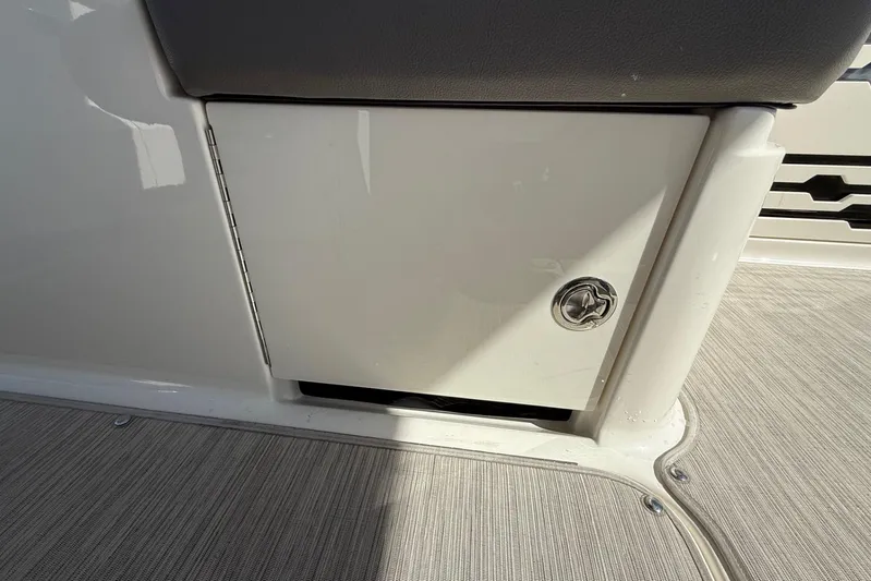  Yacht Photos Pics 2021 Sea Ray SLX 310 storage compartment with lock, featuring sleek design and durable materials.