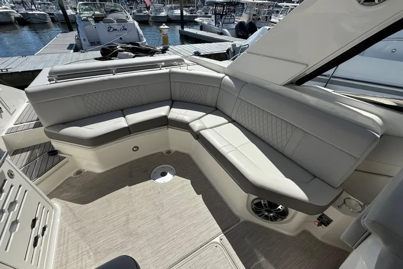  Yacht Photos Pics Luxurious seating area on a 2021 Sea Ray SLX 310 boat at a marina.