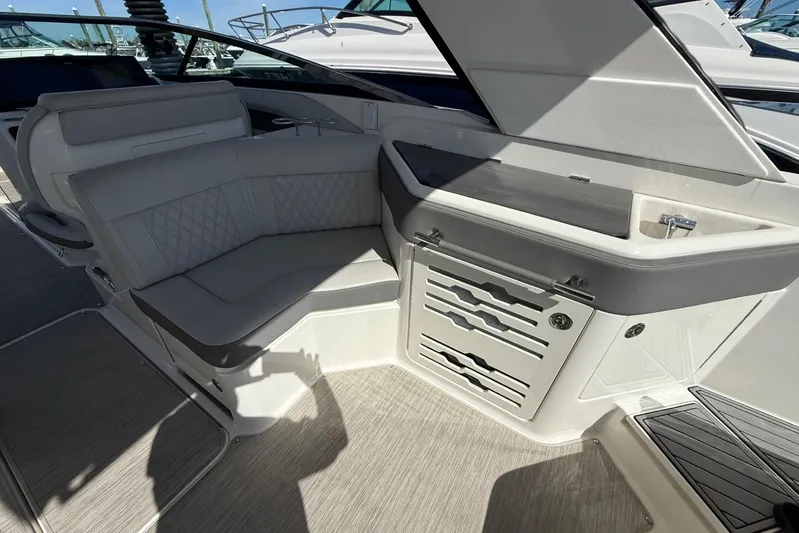  Yacht Photos Pics 2021 Sea Ray SLX 310 interior with luxurious seating and storage compartments.