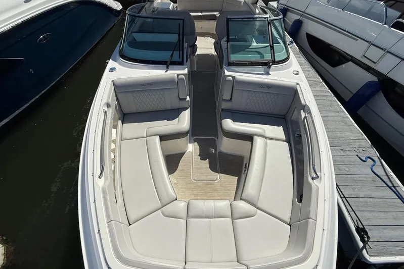  Yacht Photos Pics 2021 Sea Ray SLX 310 boat with spacious seating, docked at marina.