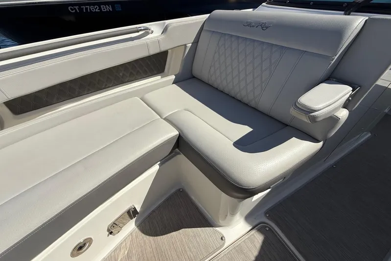  Yacht Photos Pics 2021 Sea Ray SLX 310 boat interior with luxurious seating and armrest.