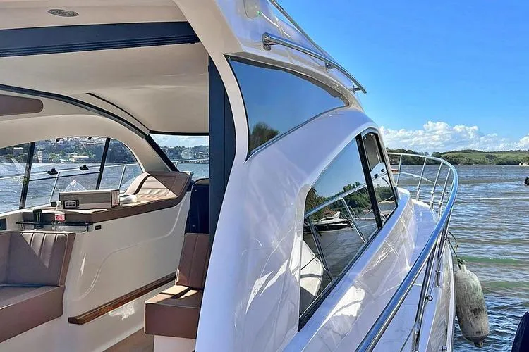 Custom Order Your 415 Today! Yacht Photos Pics Luxurious 2026 Hanover 415 Inboard yacht with sleek design on a sunny day.