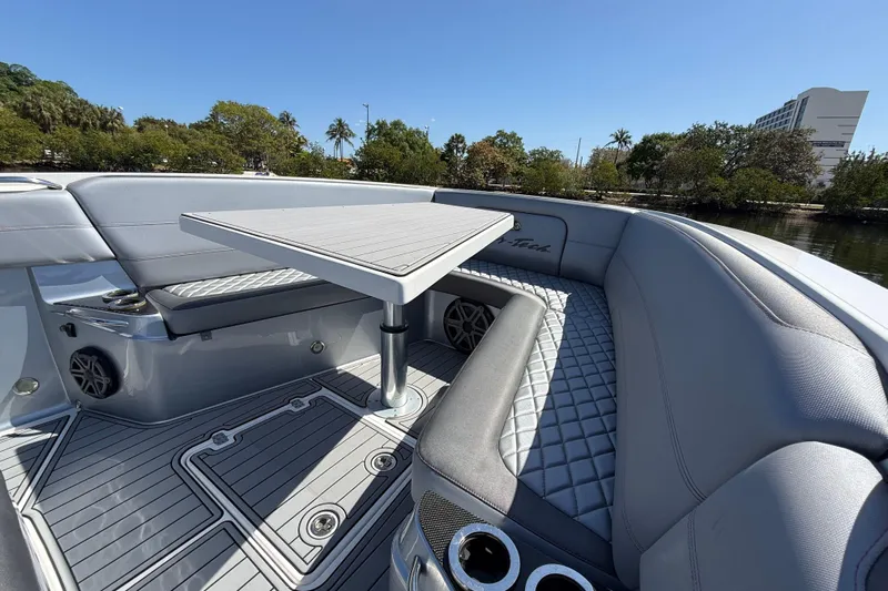  Yacht Photos Pics 2018 Nor-Tech 390 Sport Center Console boat interior with seating and table.