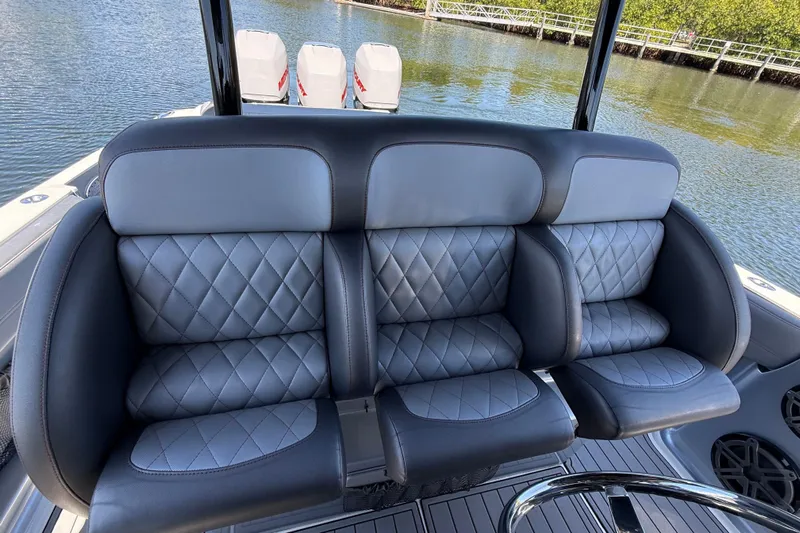  Yacht Photos Pics Luxurious seating on 2018 Nor-Tech 390 Sport Center Console boat, featuring quilted upholstery.