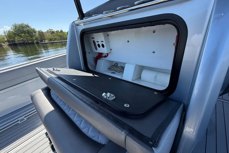  Yacht Photos Pics 2018 Nor-Tech 390 Sport Center Console storage compartment open on a sunny day.