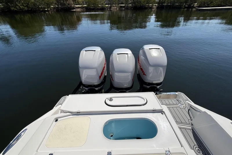  Yacht Photos Pics 2018 Nor-Tech 390 Sport Center Console with triple Mercury outboard engines on calm water.