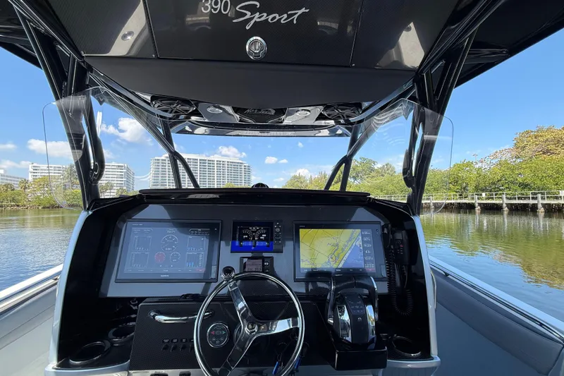  Yacht Photos Pics 2018 Nor-Tech 390 Sport Center Console dashboard with navigation screens and steering wheel.