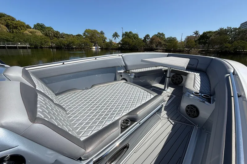  Yacht Photos Pics 2018 Nor-Tech 390 Sport Center Console with luxurious seating and table on calm water.