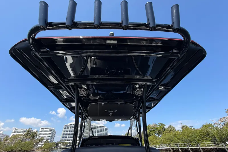  Yacht Photos Pics 2018 Nor-Tech 390 Sport Center Console boat with rod holders, under clear blue sky.