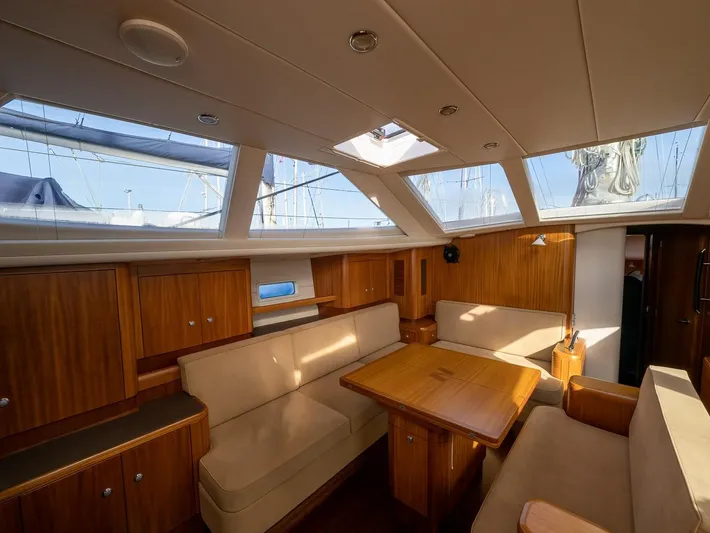 Gulliver Yacht Photos Pics Luxurious interior of 2009 Najad 570 yacht with wooden furnishings and ample natural light.