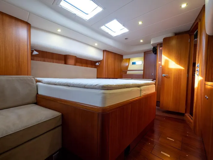 Gulliver Yacht Photos Pics Luxurious interior of 2009 Najad 570 yacht with wooden finishes and skylights.