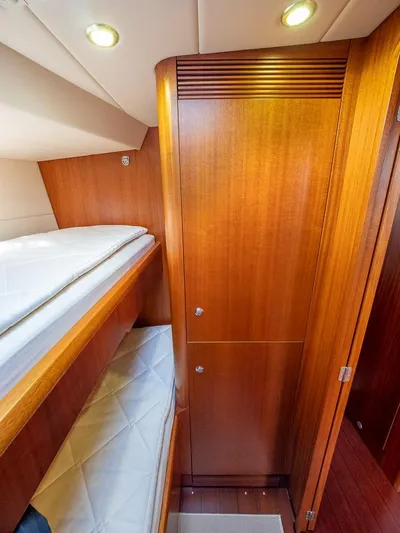 Gulliver Yacht Photos Pics Luxurious wooden interior of 2009 Najad 570 yacht cabin with bunk beds.