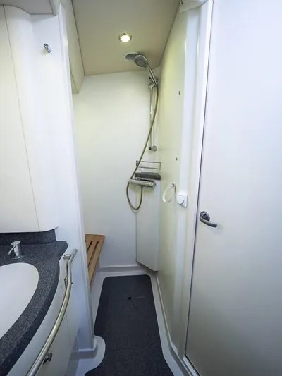 Gulliver Yacht Photos Pics Compact bathroom with shower in 2009 Najad 570 yacht, featuring modern fixtures and sleek design.