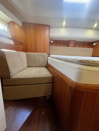 Gulliver Yacht Photos Pics Luxurious interior of 2009 Najad 570 yacht with wooden finish and cozy seating.