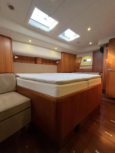 Gulliver Yacht Photos Pics Luxurious 2009 Najad 570 yacht cabin with wooden interior and skylights.