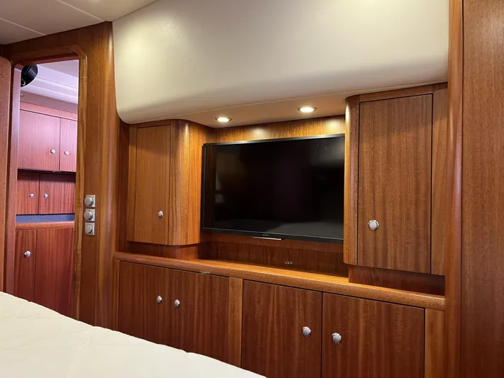 Gulliver Yacht Photos Pics Luxurious wooden interior of 2009 Najad 570 yacht with built-in TV and cabinets.