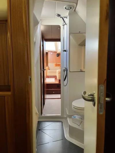 Gulliver Yacht Photos Pics Interior of 2009 Najad 570 yacht showing bathroom and living area.